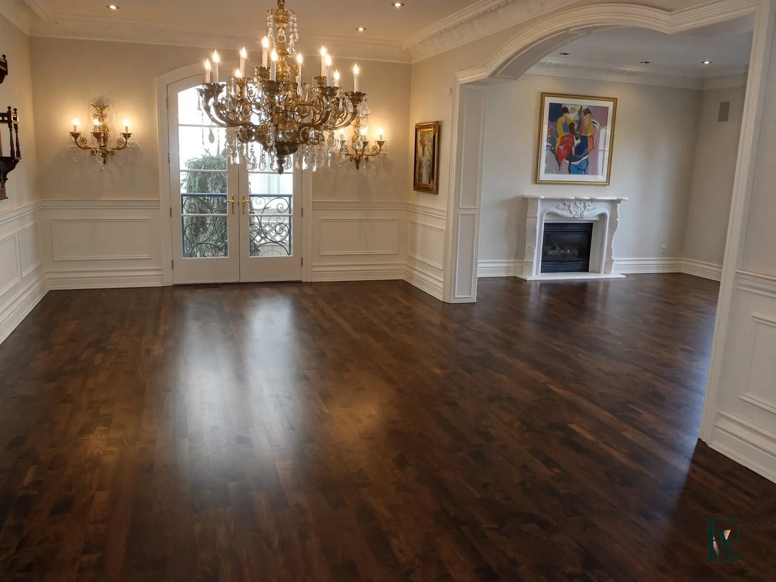 Continuous oak · two rooms — The same floor walks through the arch.