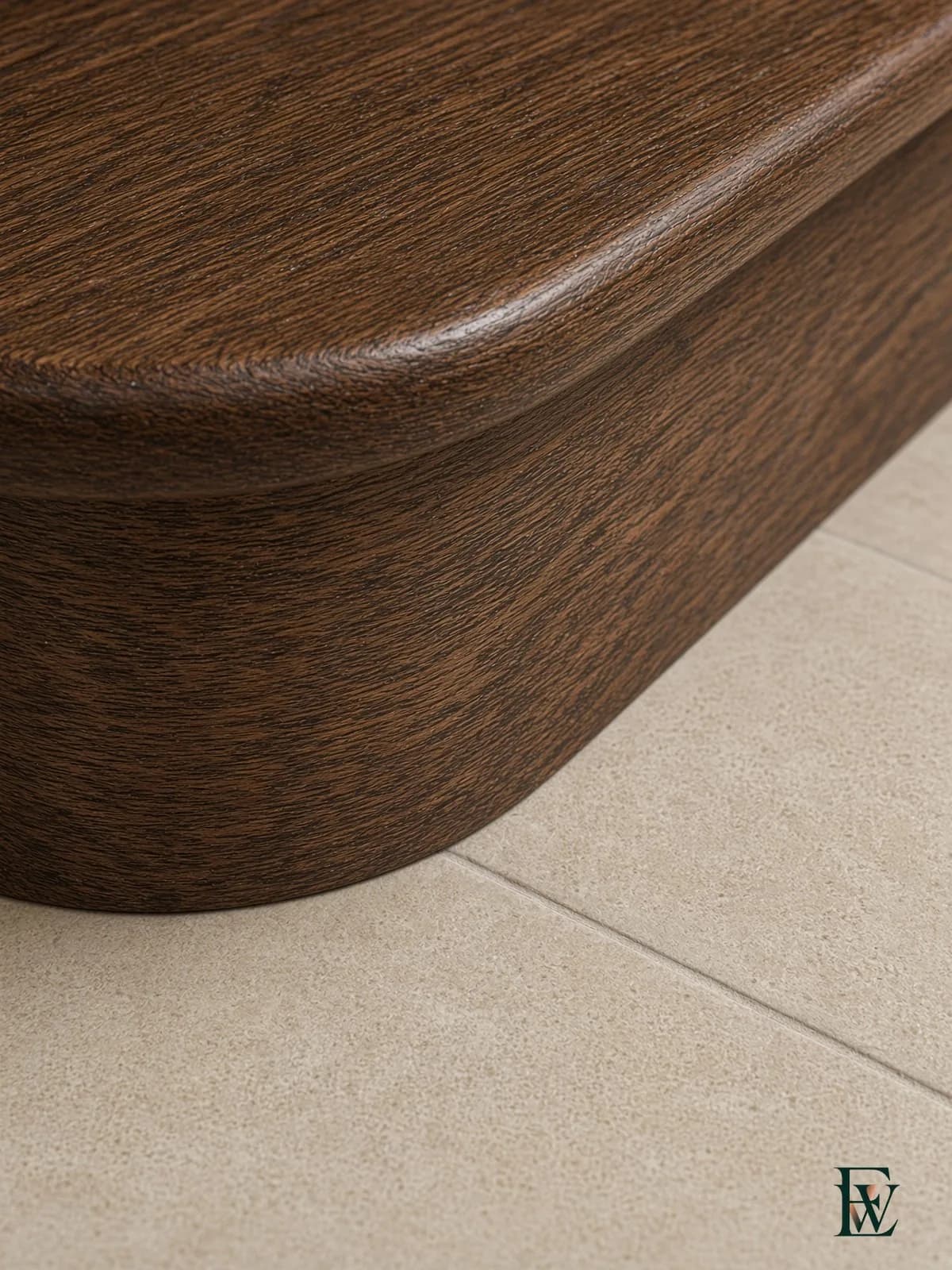 Oak treads meeting stone foyer tile, frame 3 of 3, macro of the bullnose-to-stone joint, Ecowoods site work, Toronto.