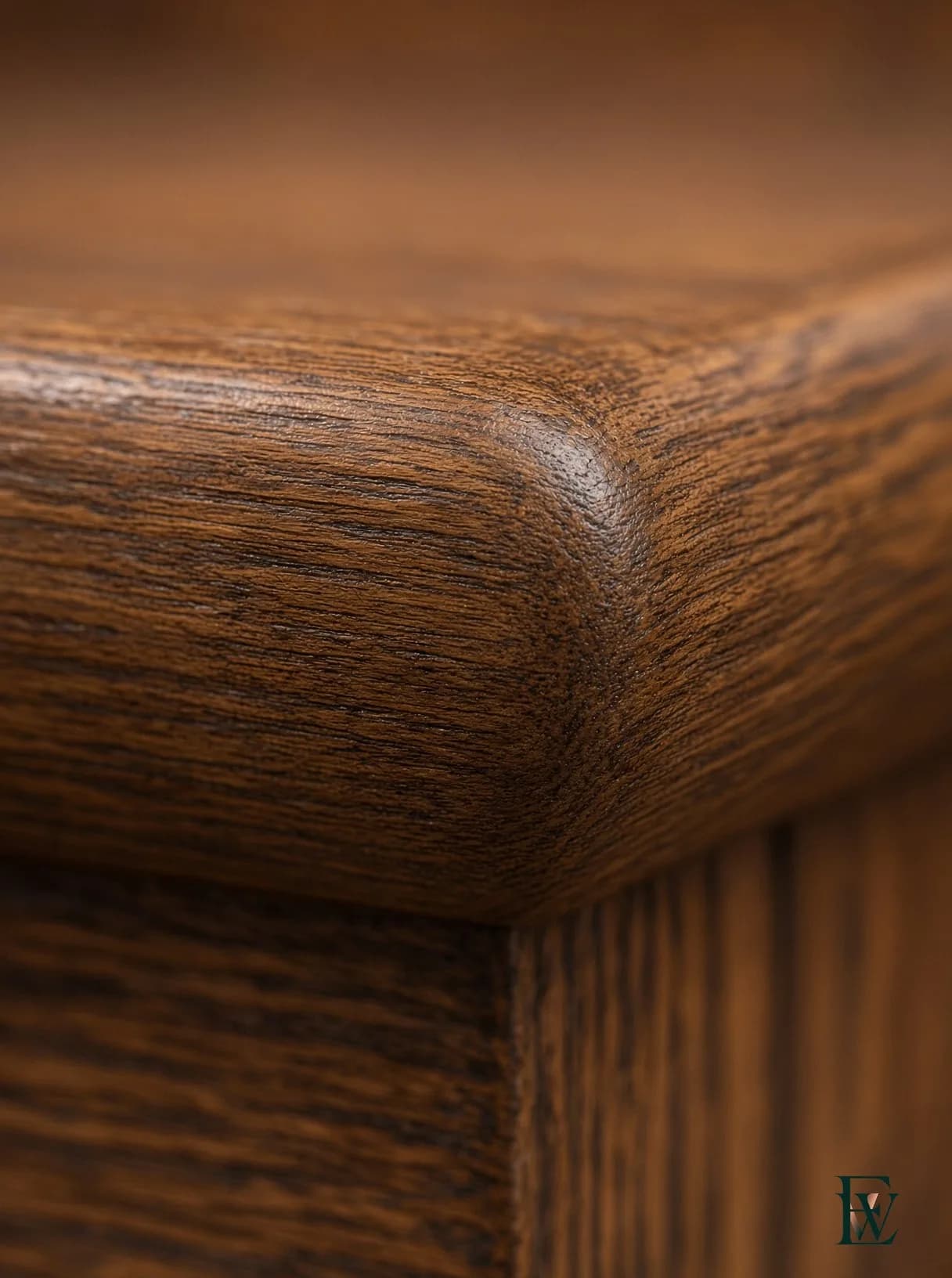 Curved oak stair, frame 3 of 3, macro of the nosing edge where tread and rail meet a hand and a foot, Ecowoods site work, Toronto.