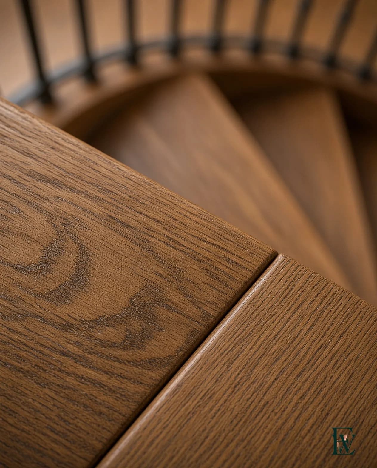 Spiral oak stair, frame 3 of 3, macro of two adjacent wedge treads and their seam, Ecowoods site work, Toronto.
