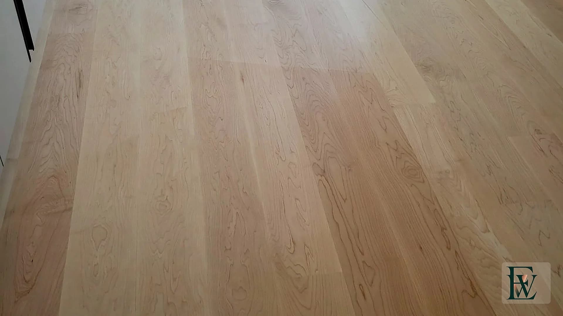 Close view of select-grade hard maple planks with natural cathedral grain and satin sheen.