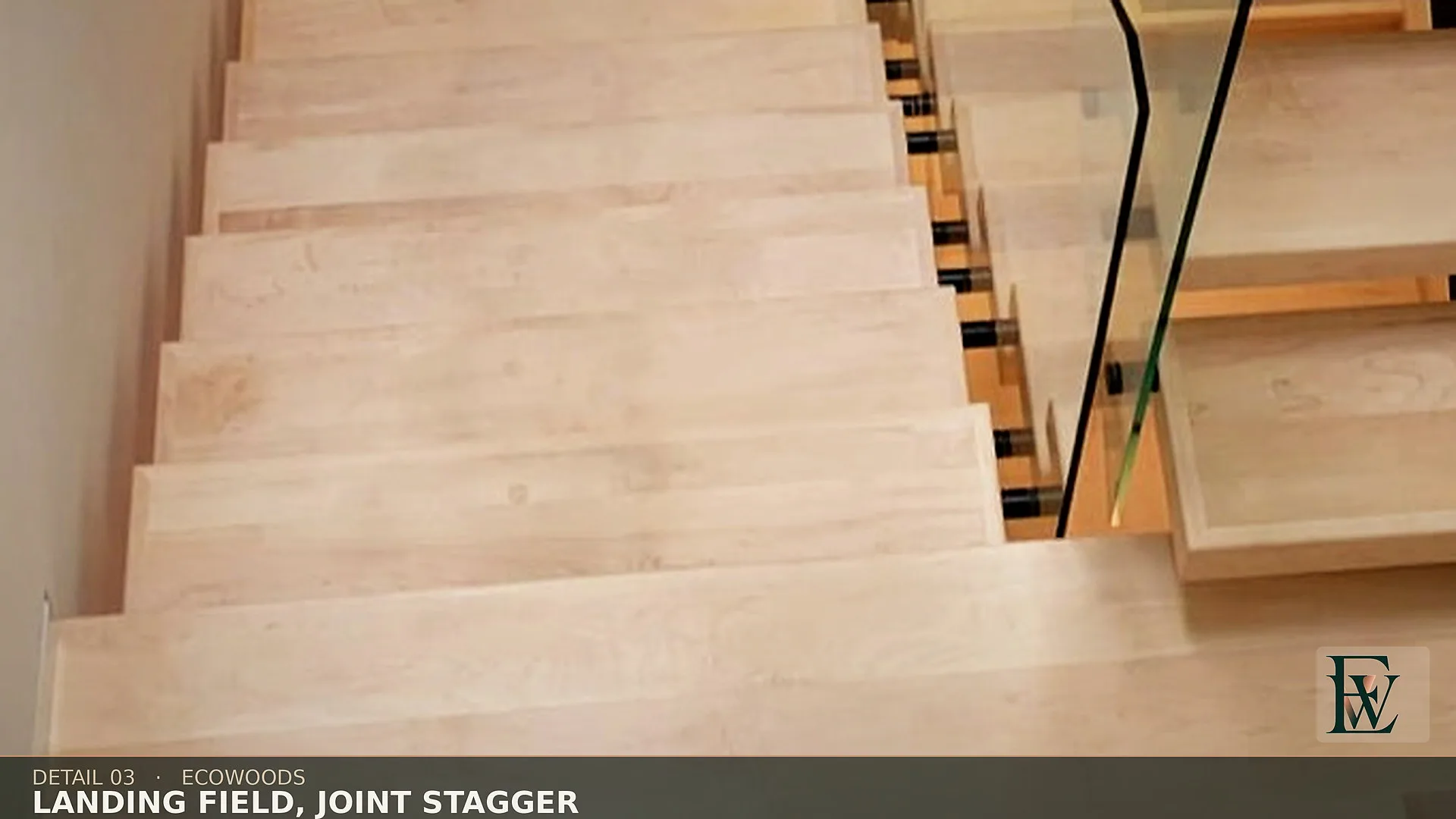 Staggered end joints on the stair landing, laid as floor rather than a leftover offcut.