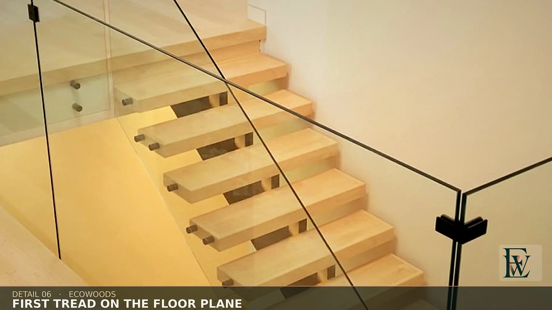 The first open-riser tread matching the upper floor in colour, thickness and sheen.
