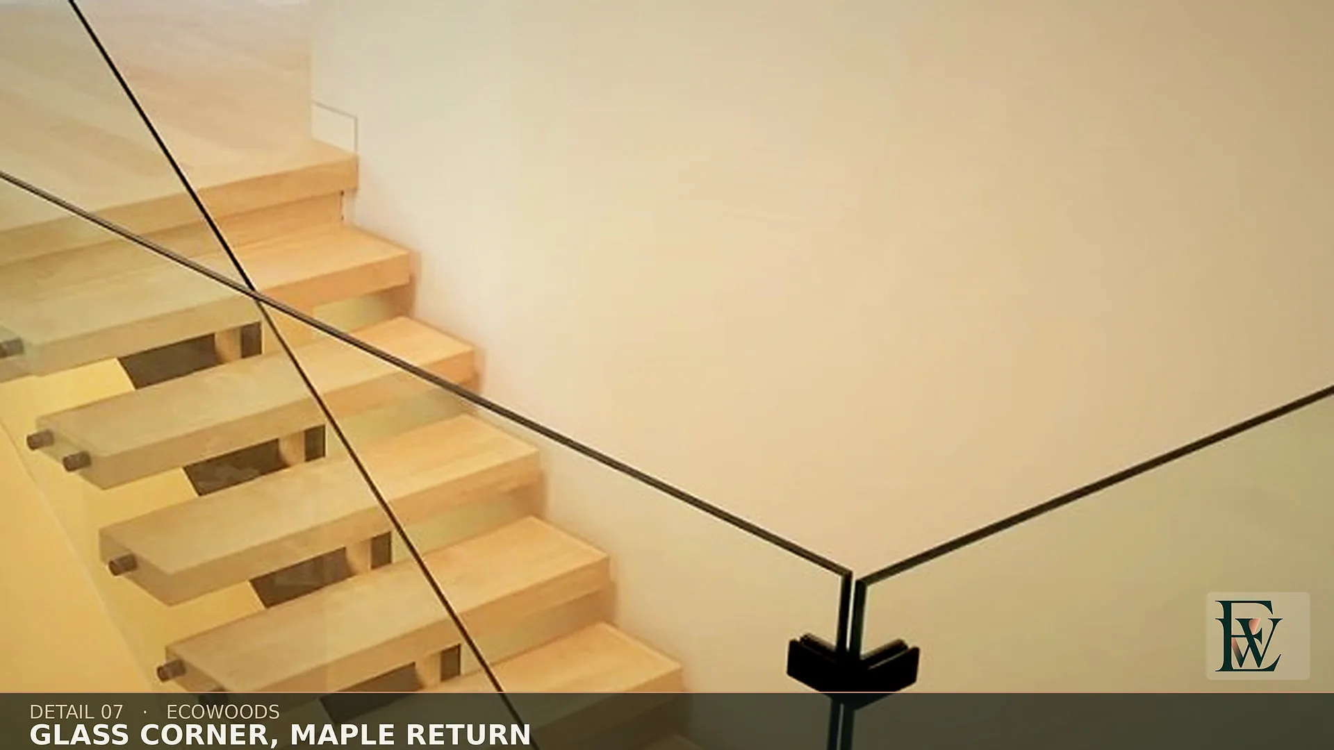 Maple flooring returning clean under a glass corner clamp, the other trade’s hardware visible.