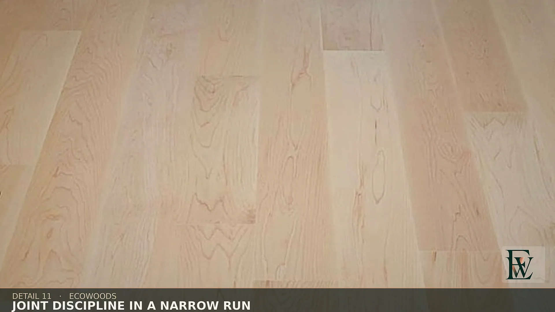 Full-length boards kept in a narrow corridor run, joints staggered rather than clustered.