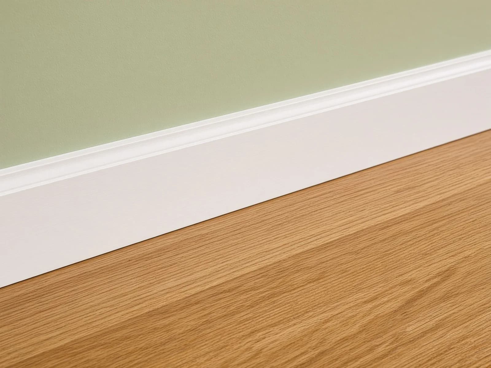 The finished floor meeting an existing baseboard in a clean, even line.