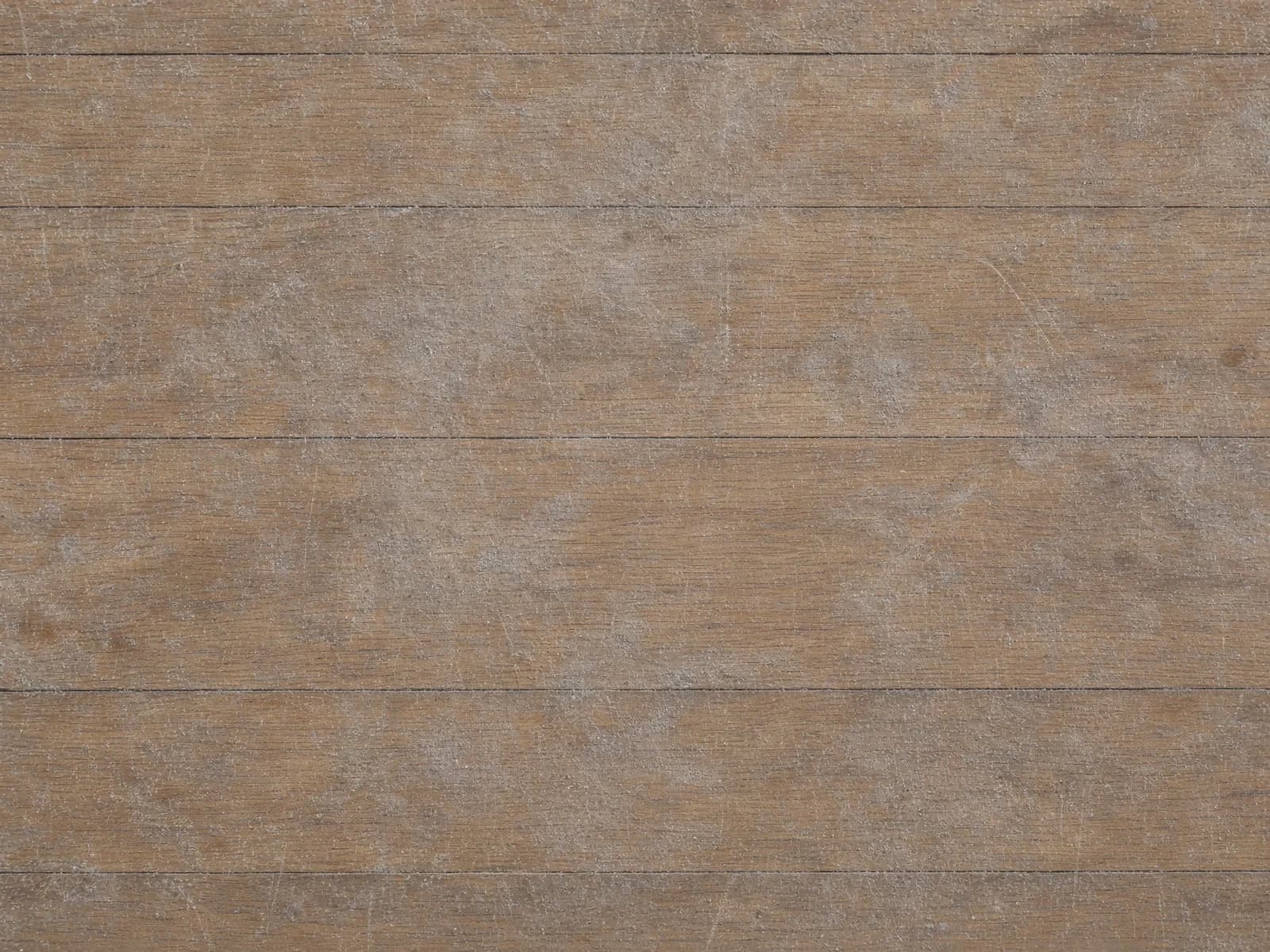 Haze and a hairline scratch worn through the old finish.