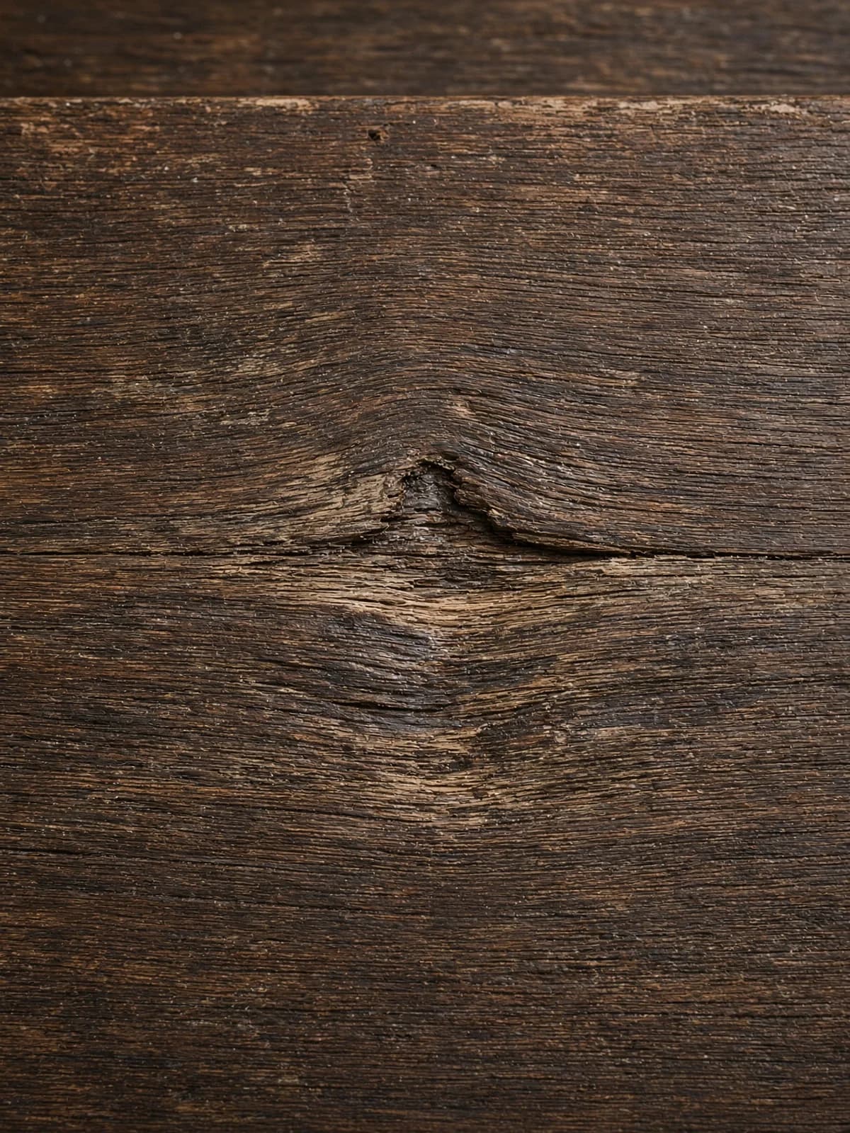 Compressed, worn grain in a stair tread from years of traffic.